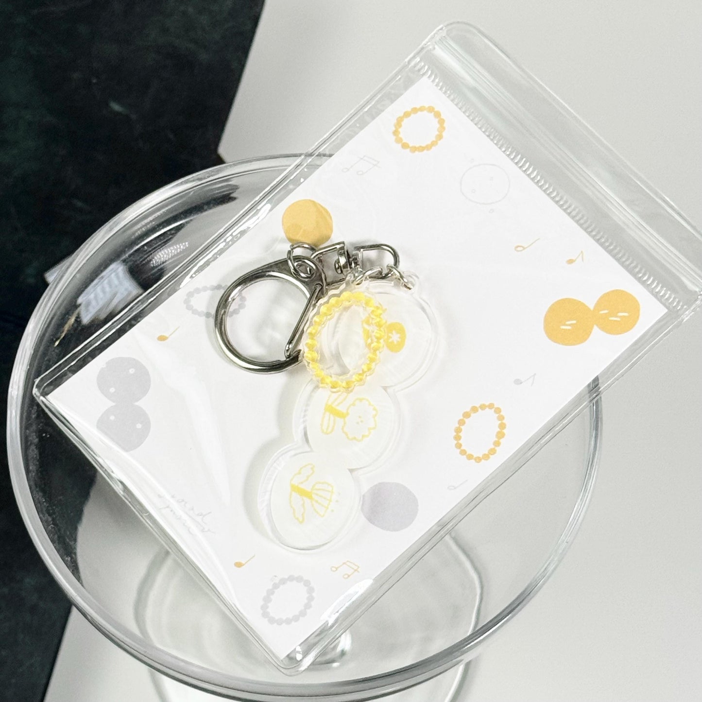 Rhythm of Circles Acrylic Keyring by Avocado Mori