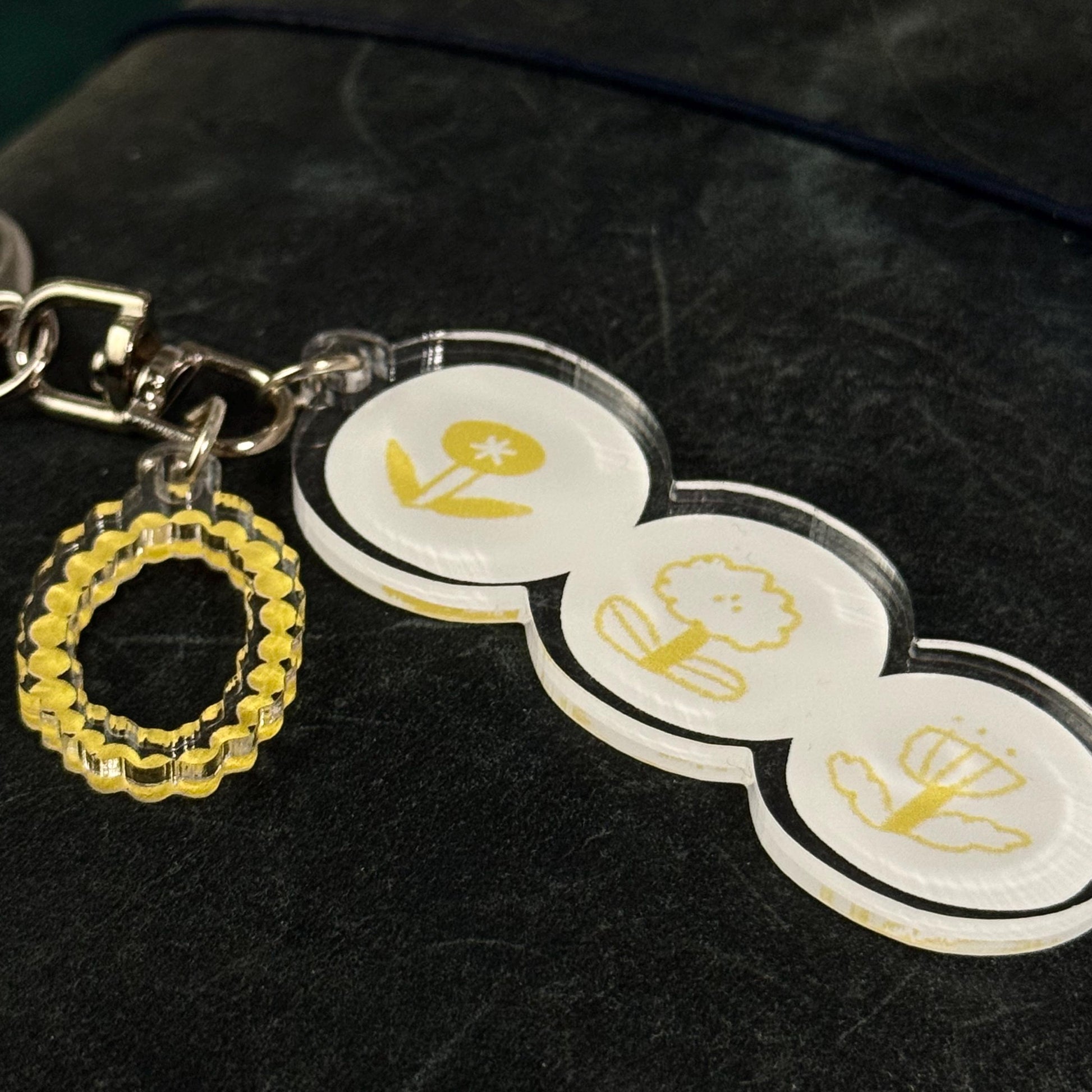 Rhythm of Circles Acrylic Keyring by Avocado Mori